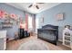 Charming Bedroom featuring a crib, a round rug, and decorative touches, perfect for a baby's room at 8635 Creedmoor Ln, New Port Richey, FL 34654