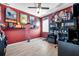 Themed bedroom with laminate flooring, fan and light fixture, window, and desk area at 8635 Creedmoor Ln, New Port Richey, FL 34654