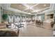 Open interior of the WatersEdge clubhouse, with comfortable seating and large windows with views at 8635 Creedmoor Ln, New Port Richey, FL 34654