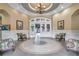 Interior view of WatersEdge clubhouse, featuring tiled floors, elegant seating, and arched doorways at 8635 Creedmoor Ln, New Port Richey, FL 34654