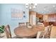 Cozy dining room features chandelier and accent wall at 8635 Creedmoor Ln, New Port Richey, FL 34654