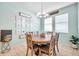 Bright dining room features modern chandelier and window at 8635 Creedmoor Ln, New Port Richey, FL 34654