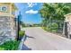 WatersEdge gated entrance with stone pillars and wrought iron gate leading into the neighborhood at 8635 Creedmoor Ln, New Port Richey, FL 34654