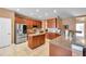 The kitchen features stainless steel appliances, granite countertops, and a functional center island at 8635 Creedmoor Ln, New Port Richey, FL 34654