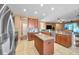 Kitchen featuring stainless steel appliances, center island, bar seating, and open layout at 8635 Creedmoor Ln, New Port Richey, FL 34654