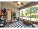 The cozy screened lanai features a ceiling fan and access to the outdoors at 8635 Creedmoor Ln, New Port Richey, FL 34654