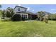 A two-story home with a well-manicured lawn and lovely screened-in lanai at 8945 Bella Vita Cir, Land O Lakes, FL 34637