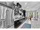 This kitchen offers stainless steel appliances, granite countertops, gas range, and generous dark wood cabinets at 8945 Bella Vita Cir, Land O Lakes, FL 34637