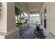 Inviting front porch with comfortable seating, offering a relaxing outdoor space at 8945 Bella Vita Cir, Land O Lakes, FL 34637