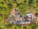 Overhead view of the property featuring the house, outbuildings and surrounding mature landscaping at 9078 Birmingham Ave, Weeki Wachee, FL 34613