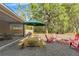 Entertain in the backyard with seating, BBQ grill, and screened in porch at 9078 Birmingham Ave, Weeki Wachee, FL 34613