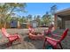 Relax in the backyard with a brick fire pit and ample seating for entertaining at 9078 Birmingham Ave, Weeki Wachee, FL 34613