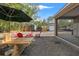 Enjoy the backyard featuring a picnic table, fire pit, and screened in porch at 9078 Birmingham Ave, Weeki Wachee, FL 34613