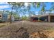 Expansive backyard features metal buildings and ample RV parking, perfect for outdoor enjoyment and vehicle storage at 9078 Birmingham Ave, Weeki Wachee, FL 34613