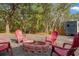 Outdoor gathering space featuring a fire pit and seating at 9078 Birmingham Ave, Weeki Wachee, FL 34613