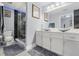 Modern bathroom featuring a double sink vanity, and walk-in shower with contemporary fixtures at 9078 Birmingham Ave, Weeki Wachee, FL 34613