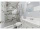 Bathroom featuring a glass shower, toilet, and modern vanity at 9078 Birmingham Ave, Weeki Wachee, FL 34613