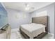 Comfortable bedroom featuring a ceiling fan, and stylish decor at 9078 Birmingham Ave, Weeki Wachee, FL 34613
