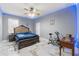 Spacious bedroom featuring a ceiling fan, marble floors, and exercise equipment at 9078 Birmingham Ave, Weeki Wachee, FL 34613