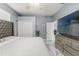 Modern bedroom with closet doors and a large TV at 9078 Birmingham Ave, Weeki Wachee, FL 34613