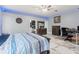 Spacious bedroom boasting a work space, comfortable bed, and stylish decor at 9078 Birmingham Ave, Weeki Wachee, FL 34613