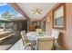 Stylish covered patio with comfortable seating and a peaceful outdoor ambiance at 9078 Birmingham Ave, Weeki Wachee, FL 34613