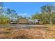 Spacious backyard with metal building, RVs, and covered parking, providing space for vehicles and relaxation at 9078 Birmingham Ave, Weeki Wachee, FL 34613