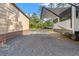 Spacious gravel driveway with a metal building, boat, and RV parking under awning, offering ample outdoor storage and parking at 9078 Birmingham Ave, Weeki Wachee, FL 34613