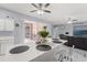 Kitchen featuring a breakfast bar with marble countertops and stainless steel appliances overlooking the spacious living room at 9078 Birmingham Ave, Weeki Wachee, FL 34613