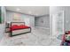 Spacious main bedroom with marble floors, a large bed, and an en-suite bathroom featuring a walk-in shower at 9078 Birmingham Ave, Weeki Wachee, FL 34613