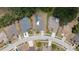 Aerial view of a home showing pool, landscaping, fencing, driveway and neighboring homes on a quiet street at 9104 Water Hazard Dr, Hudson, FL 34667