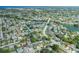 Aerial view of the property and neighborhood showcasing the location near Embassy Blvd and U.S. Hwy 19 at 9141 Greenbriar Ln, Port Richey, FL 34668