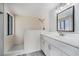 Bathroom featuring a walk-in shower, modern vanity, and stylish fixtures at 9141 Greenbriar Ln, Port Richey, FL 34668