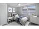 Cozy bedroom featuring a ceiling fan, natural light, and a closet for ample storage at 9141 Greenbriar Ln, Port Richey, FL 34668