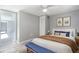 Bedroom with bench, rug, closet, and view into hallway at 9141 Greenbriar Ln, Port Richey, FL 34668