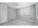 Bedroom features include a ceiling fan, closet, and a window for natural light at 9141 Greenbriar Ln, Port Richey, FL 34668