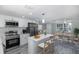 Bright kitchen featuring a center island with seating, stainless appliances and connection to dining area at 9141 Greenbriar Ln, Port Richey, FL 34668