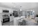 Modern kitchen boasting stainless steel appliances, a stylish island with seating, and ample counter space at 9141 Greenbriar Ln, Port Richey, FL 34668