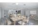 Well-designed kitchen next to dining room featuring a central island, stainless steel appliances at 9141 Greenbriar Ln, Port Richey, FL 34668