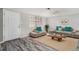 Bright and inviting living room with modern furniture, stylish decor, and light wood flooring at 9141 Greenbriar Ln, Port Richey, FL 34668