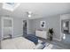 Bedroom features a ceiling fan, skylight, and a walk-in closet for ample storage at 9141 Greenbriar Ln, Port Richey, FL 34668
