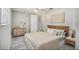 Bright main bedroom with ceiling fan and hardwood floors, offering generous space at 9141 Greenbriar Ln, Port Richey, FL 34668