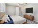 Bright main bedroom with ceiling fan, hardwood floors, and ample space for furniture at 9141 Greenbriar Ln, Port Richey, FL 34668