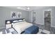 Bedroom with neutral walls, ceiling fan, walk-in closet and views to the bathroom at 9141 Greenbriar Ln, Port Richey, FL 34668