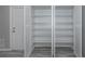 Storage room with an open view of the shelves and neutral-colored walls at 9141 Greenbriar Ln, Port Richey, FL 34668