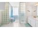Unique bathroom featuring glass block walls and bright natural light, creating a serene and modern atmosphere at 9208 Butler Blvd, Weeki Wachee, FL 34613