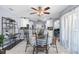 The dining area is connected to the kitchen; it boasts tile floors, a table with chairs, and decorative shelving at 9208 Butler Blvd, Weeki Wachee, FL 34613