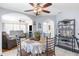 Bright dining area features a table, chairs, and decorative shelving, perfect for entertaining or Gathering meals at 9208 Butler Blvd, Weeki Wachee, FL 34613