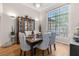 Dining room features a large window and modern decor, perfect for entertaining at 9208 Butler Blvd, Weeki Wachee, FL 34613