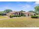 Charming home featuring lush lawn, landscaping, and inviting exterior at 9208 Butler Blvd, Weeki Wachee, FL 34613